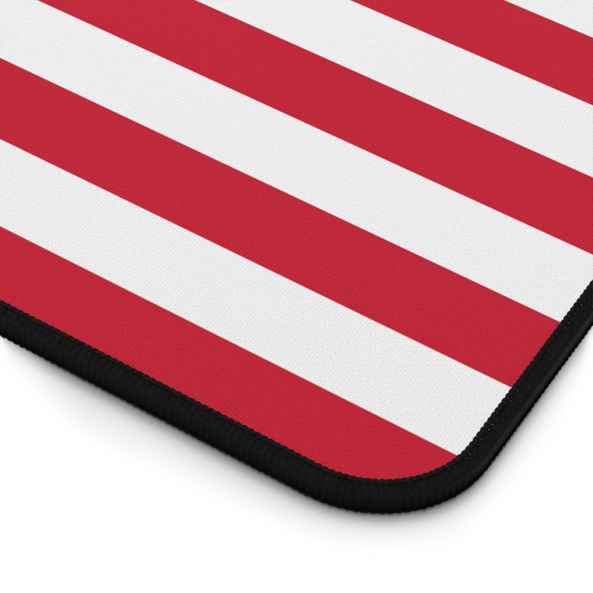 Red and white striped mouse pad with a black border on a white background