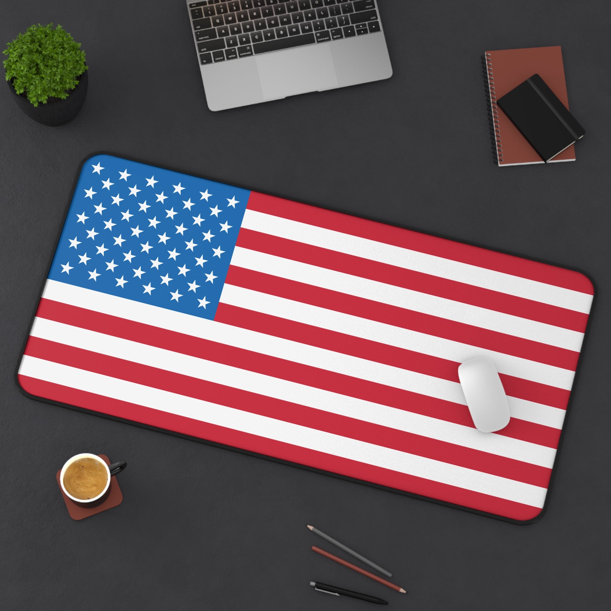 American flag mouse pad on a desk with office items