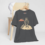 Asphalt t-shirt with astronaut graphic and 'DIBS' text on a wooden chair.