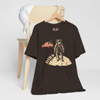 Brown t-shirt with astronaut graphic and 'DIBS' text on a white background