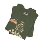 Folded military green t-shirt with astronaut and American flag design on a white background