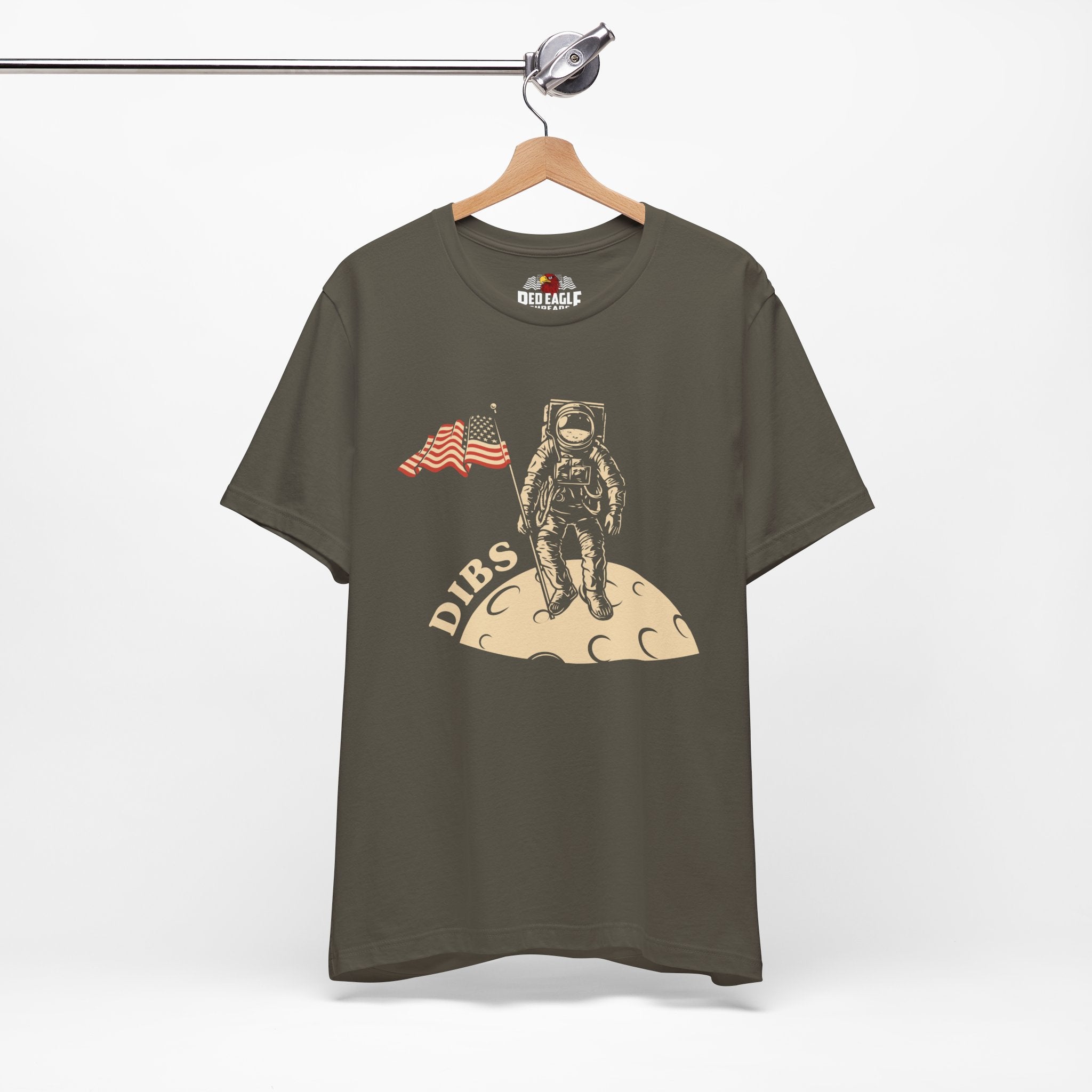 Army Green t-shirt with astronaut graphic and 'DIBS' text on a hanger against a white background