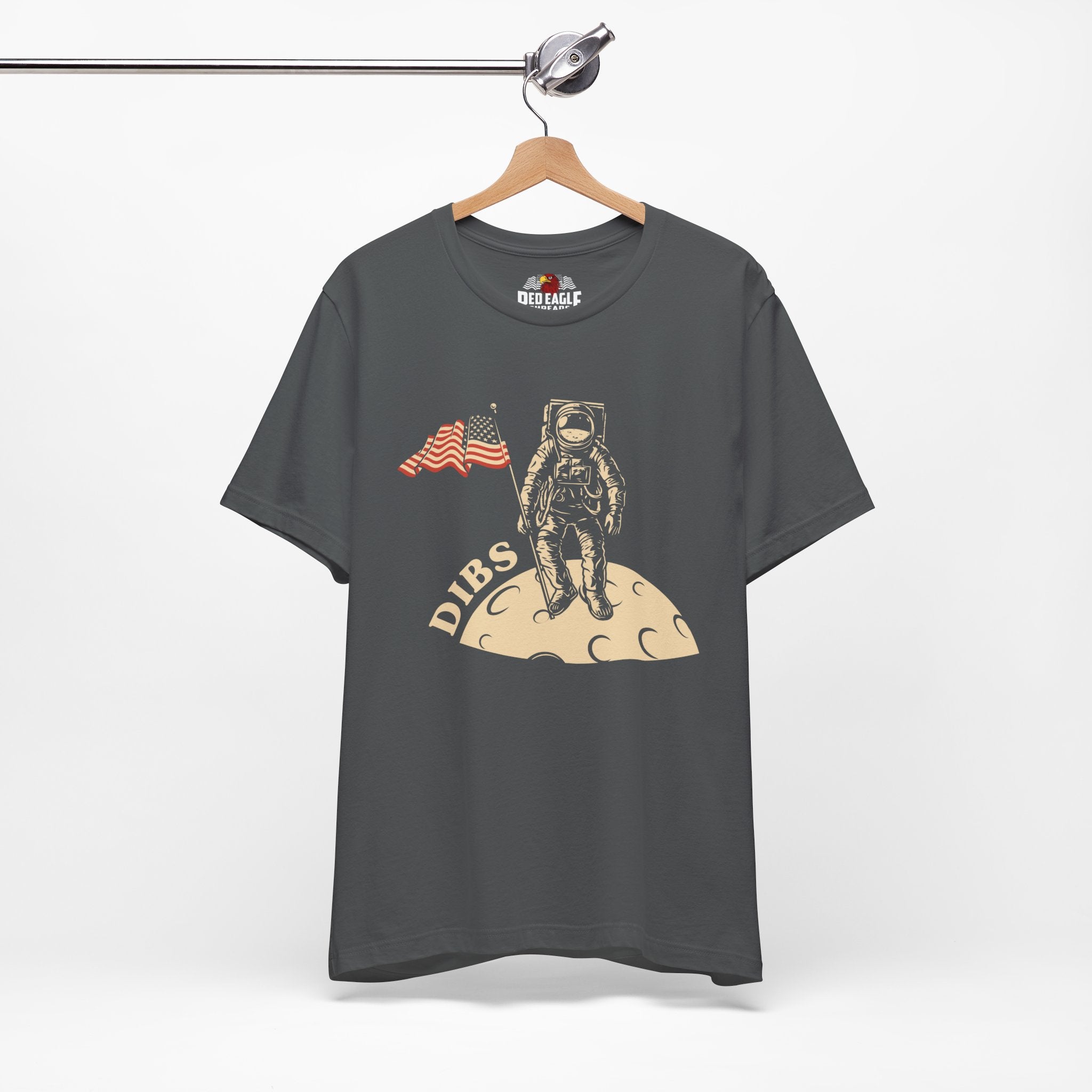 Asphalt t-shirt with astronaut graphic and 'DIBS' text on a hanger against a white background