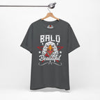 Gray t-shirt with an eagle graphic and 'Bald is Beautiful' text on a hanger against a white background.