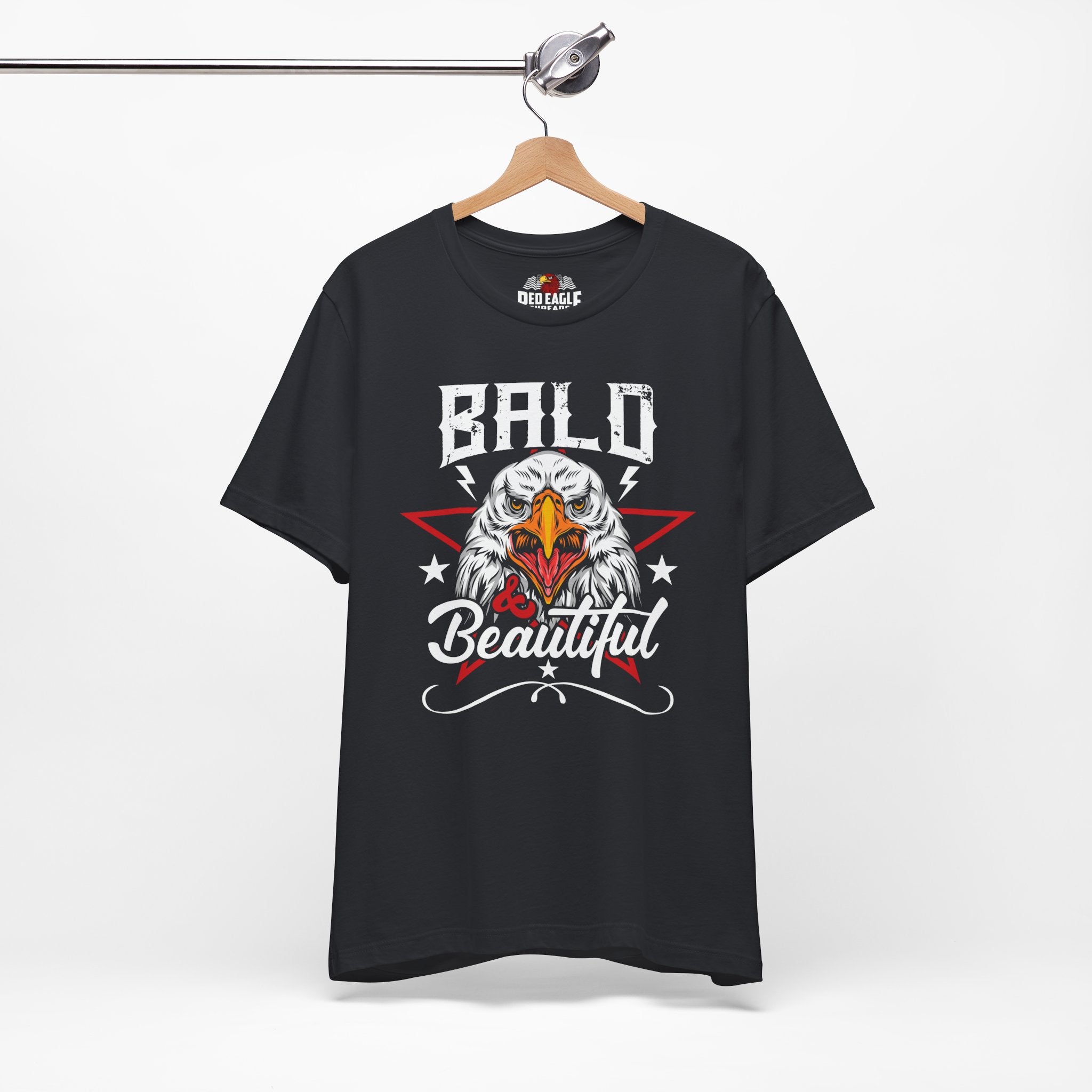 Vintage Black t-shirt with bald eagle graphic and 'Bald is Beautiful' text on a hanger against a white background.