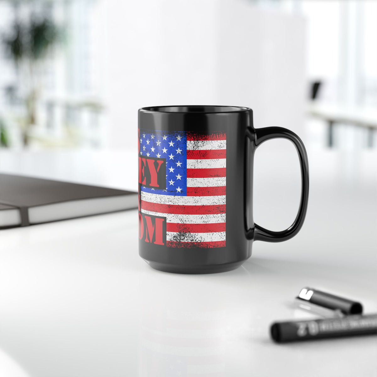 Black mug with American flag design on a desk