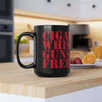 Black mug with red text 'CIGAR WHIS GUNS FREE' on a kitchen counter.