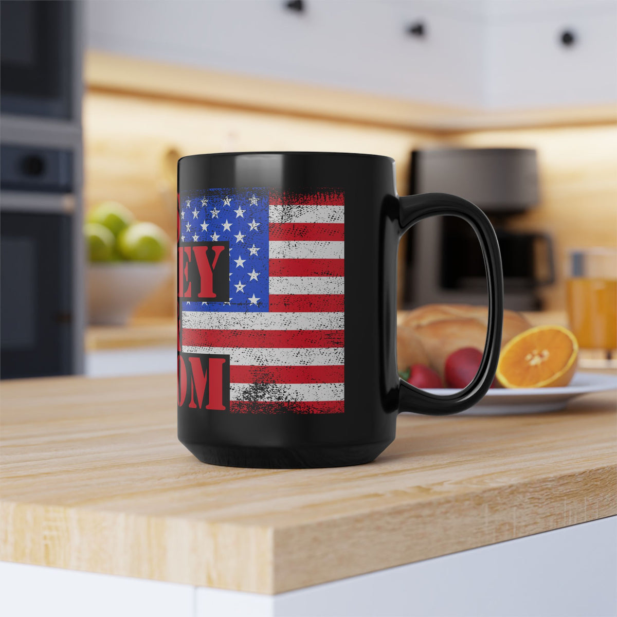 Black mug with American flag design and 'Fry Mom' text on a kitchen counter.