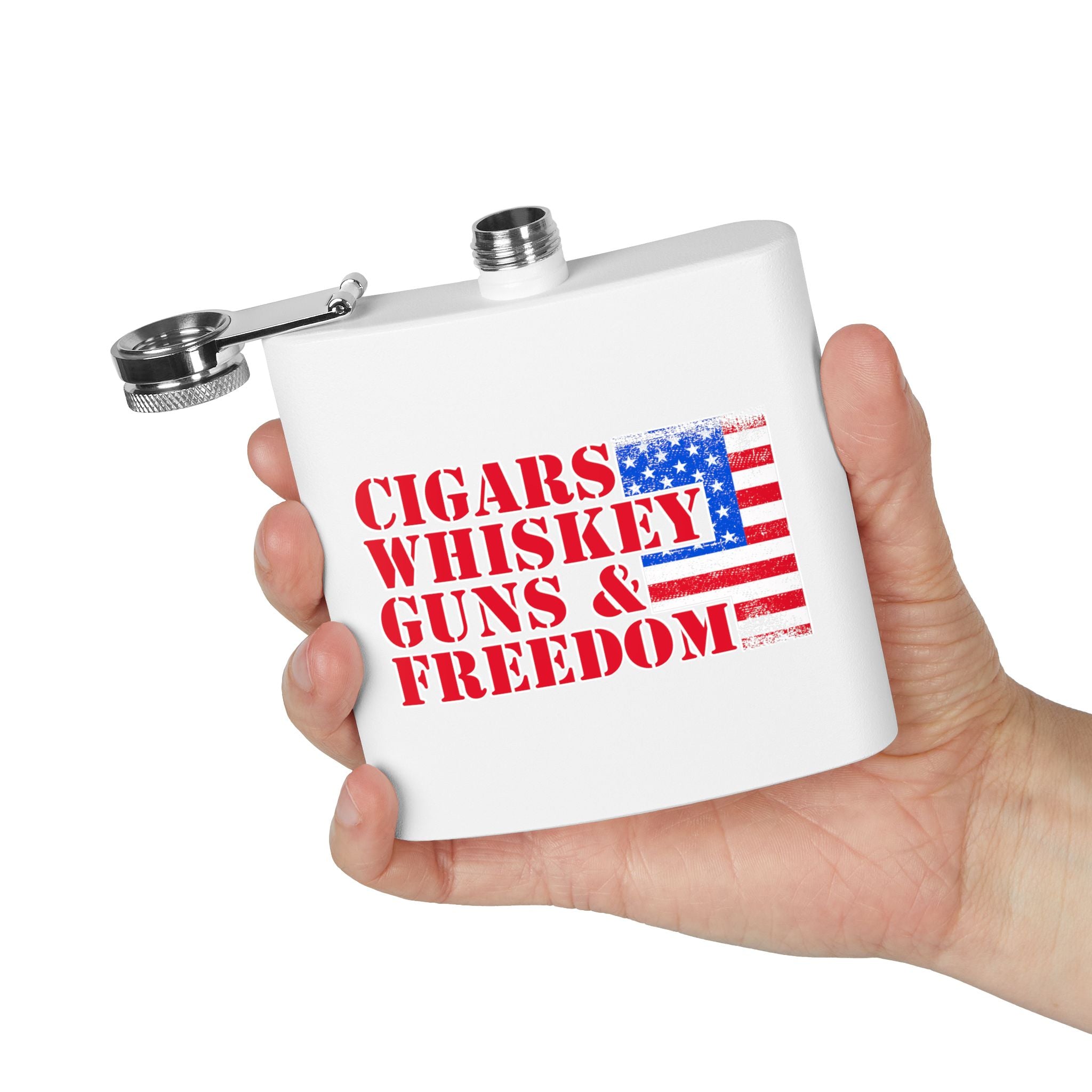 White flask with 'Cigars Whiskey Guns & Freedom' text and American flag design held by a hand on a white background