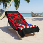 Beach towel with American flag design on a lounge chair at the beach