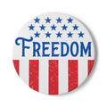 Button badge with 'FREEDOM' text and American flag design on a white background