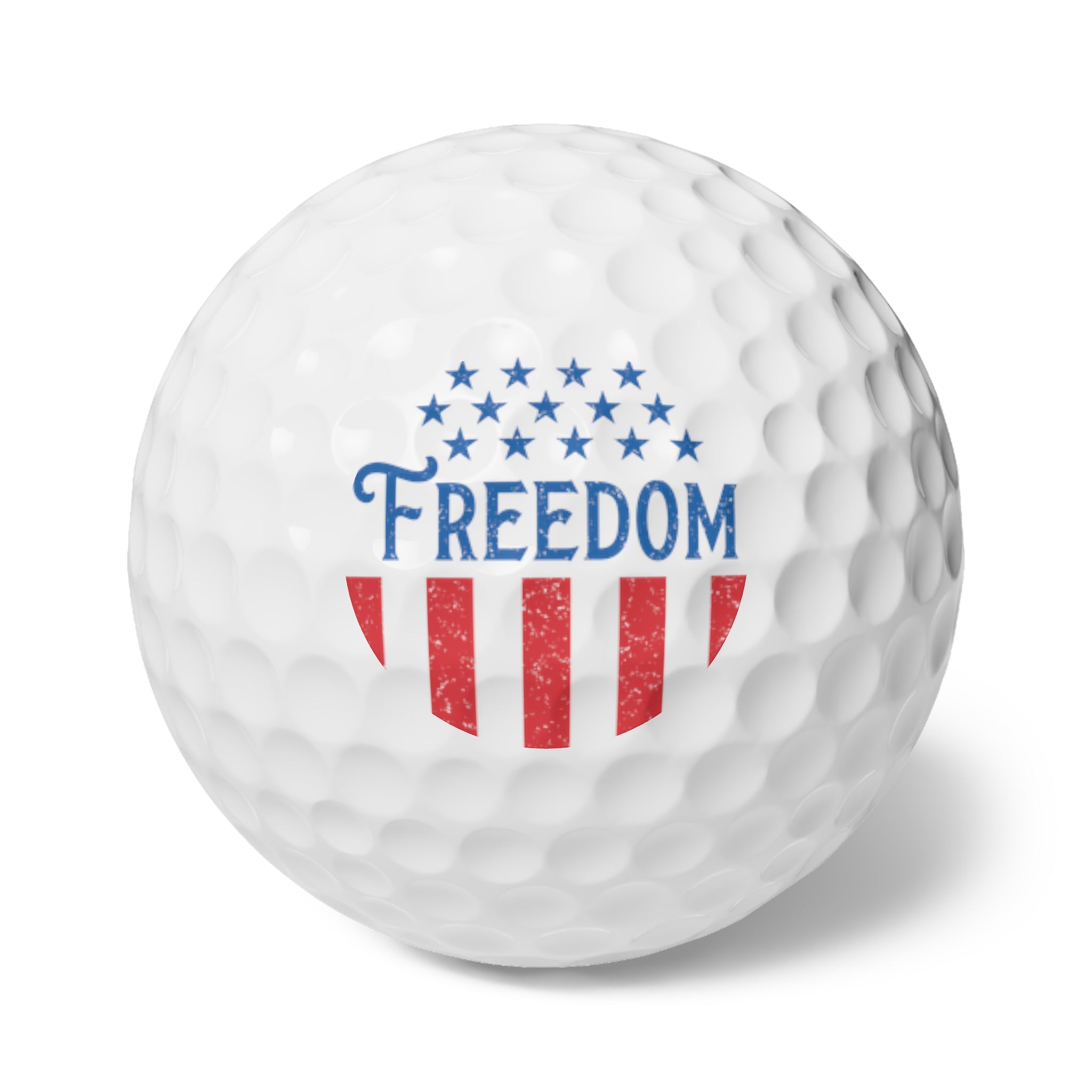 Golf ball with 'Freedom' and American flag design on a white background