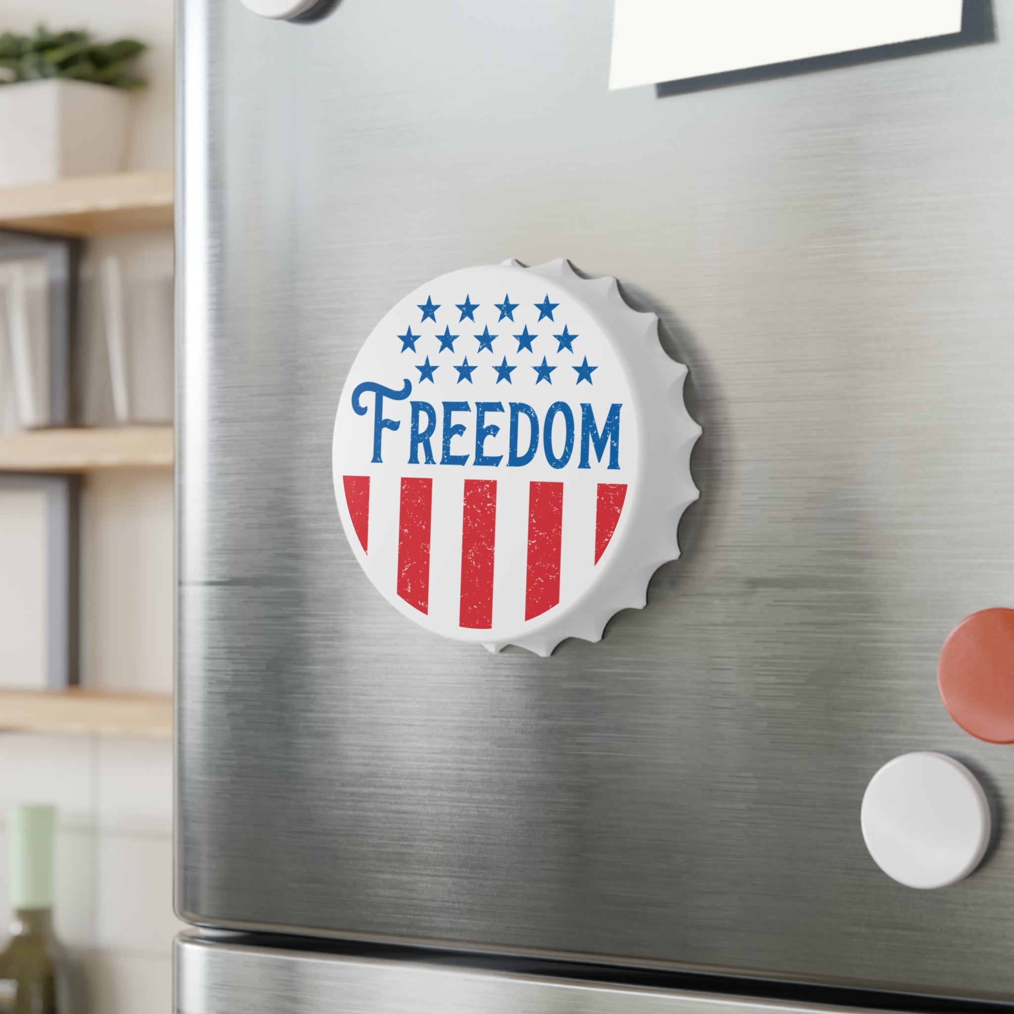 Fridge magnet with 'FREEDOM' text on a metallic surface