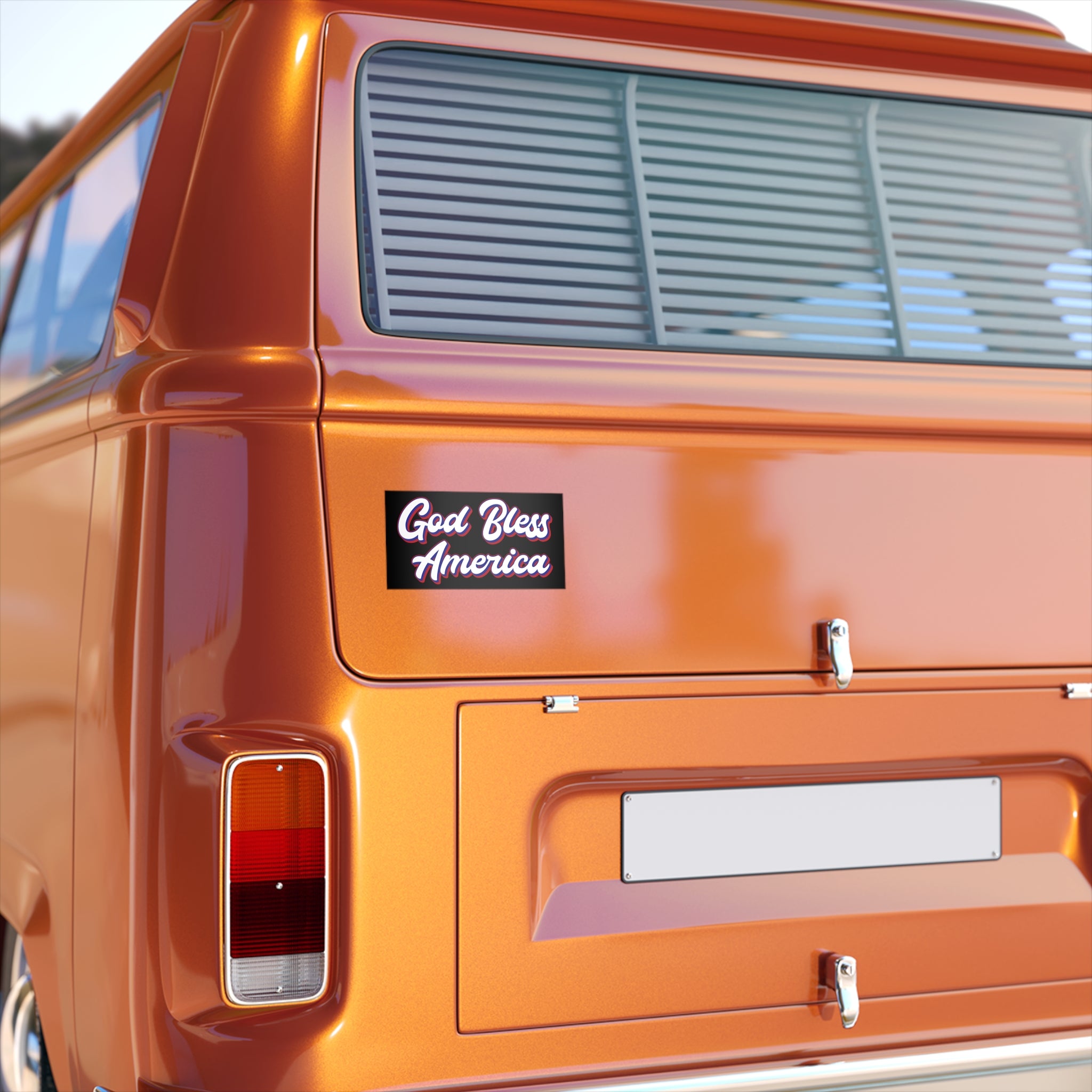 Orange vehicle with 'God Bless America' Vinyl Bumper Sticker on the back
