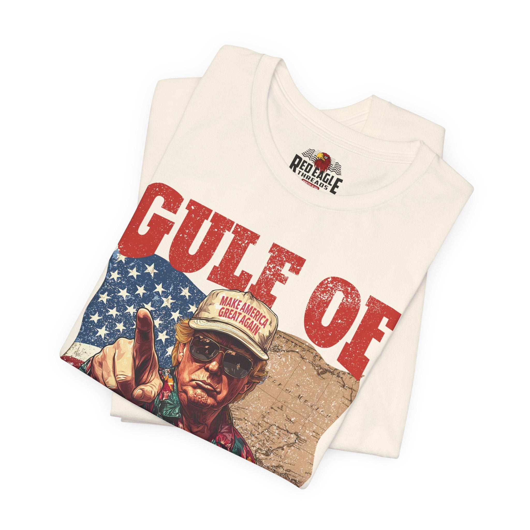 Folded t-shirt with graphic design and text on a white background
