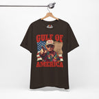 Brown t-shirt with graphic design and text 'Gulf of America' on a hanger against a white background