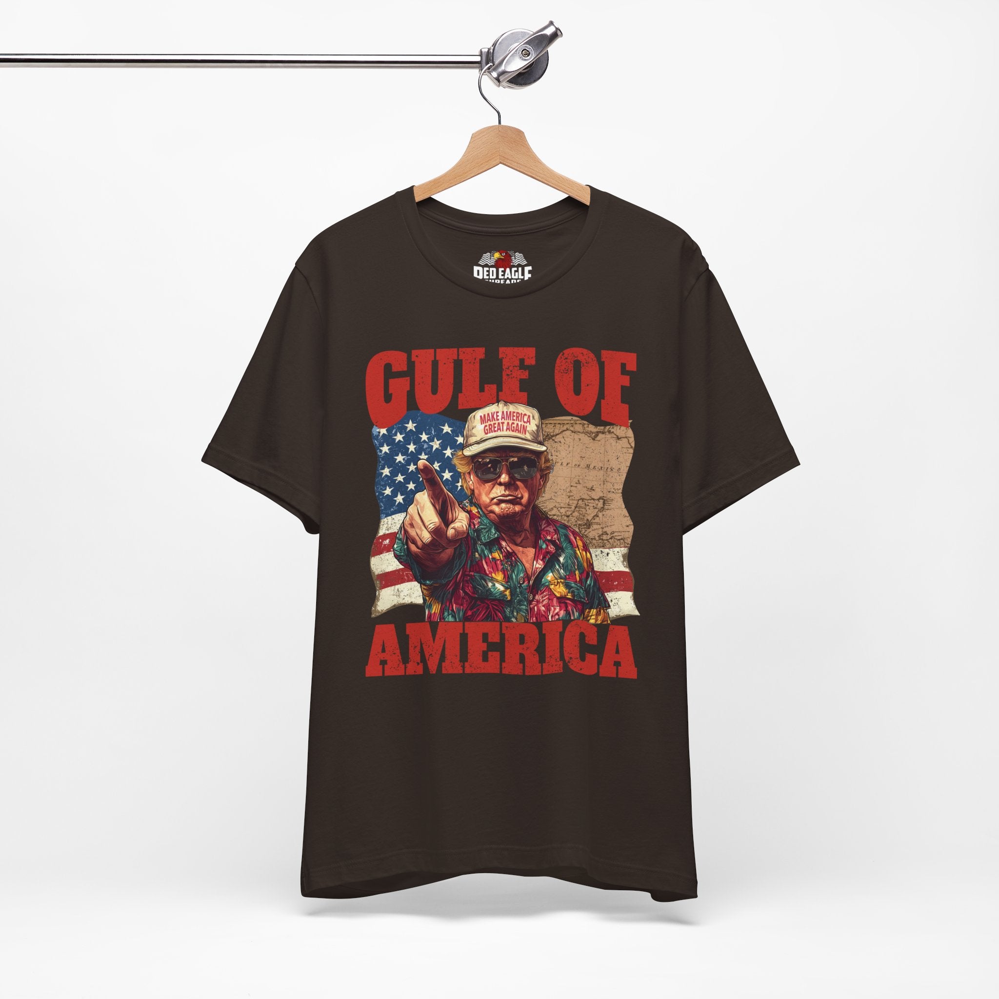 Brown t-shirt with graphic design and text 'Gulf of America' on a hanger against a white background