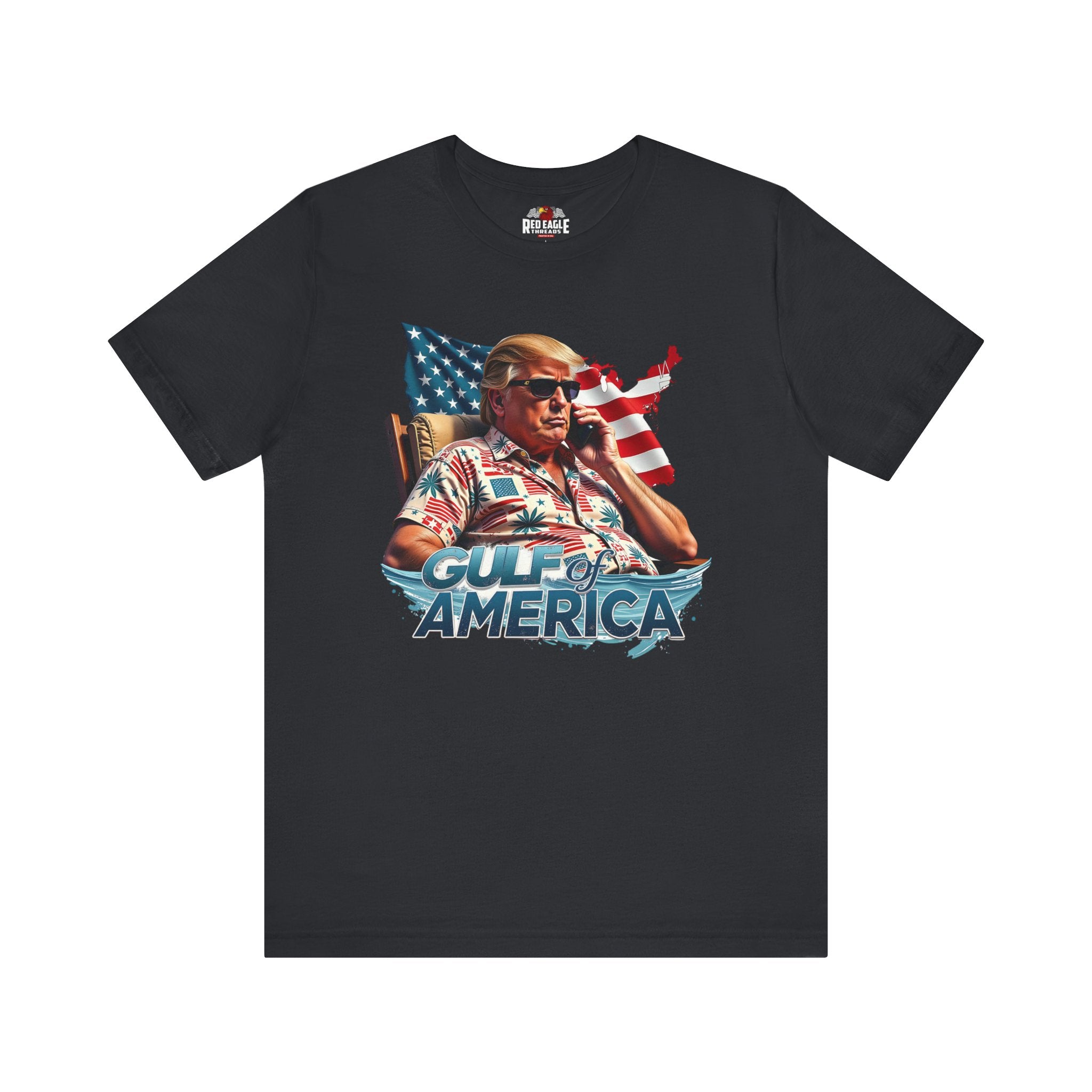 Black t-shirt with graphic of a person on a phone with an American flag, labeled 'Gulf of America', on a white background.