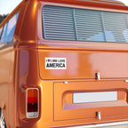 Orange vehicle with a 'I LOVE AMERICA' sticker on the back