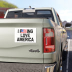 Back of a truck with a 'I F***ING LOVE AMERICA' magnet on a clear day.