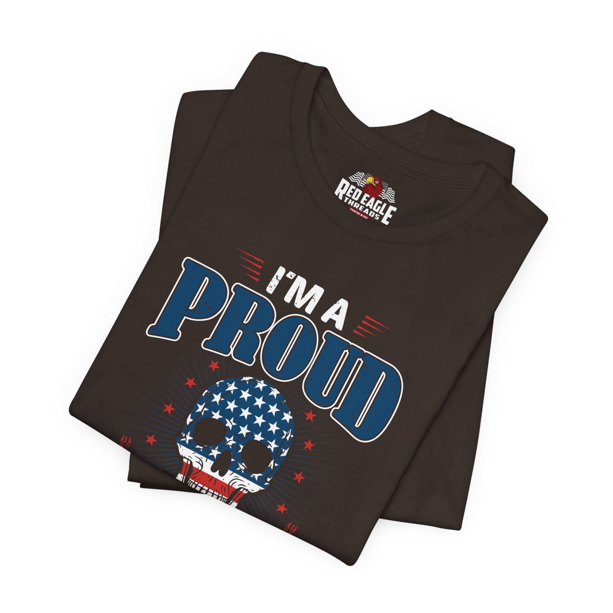 Folded brown t-shirt with 'I'm a Proud' design and Red Eagle logo on a white background