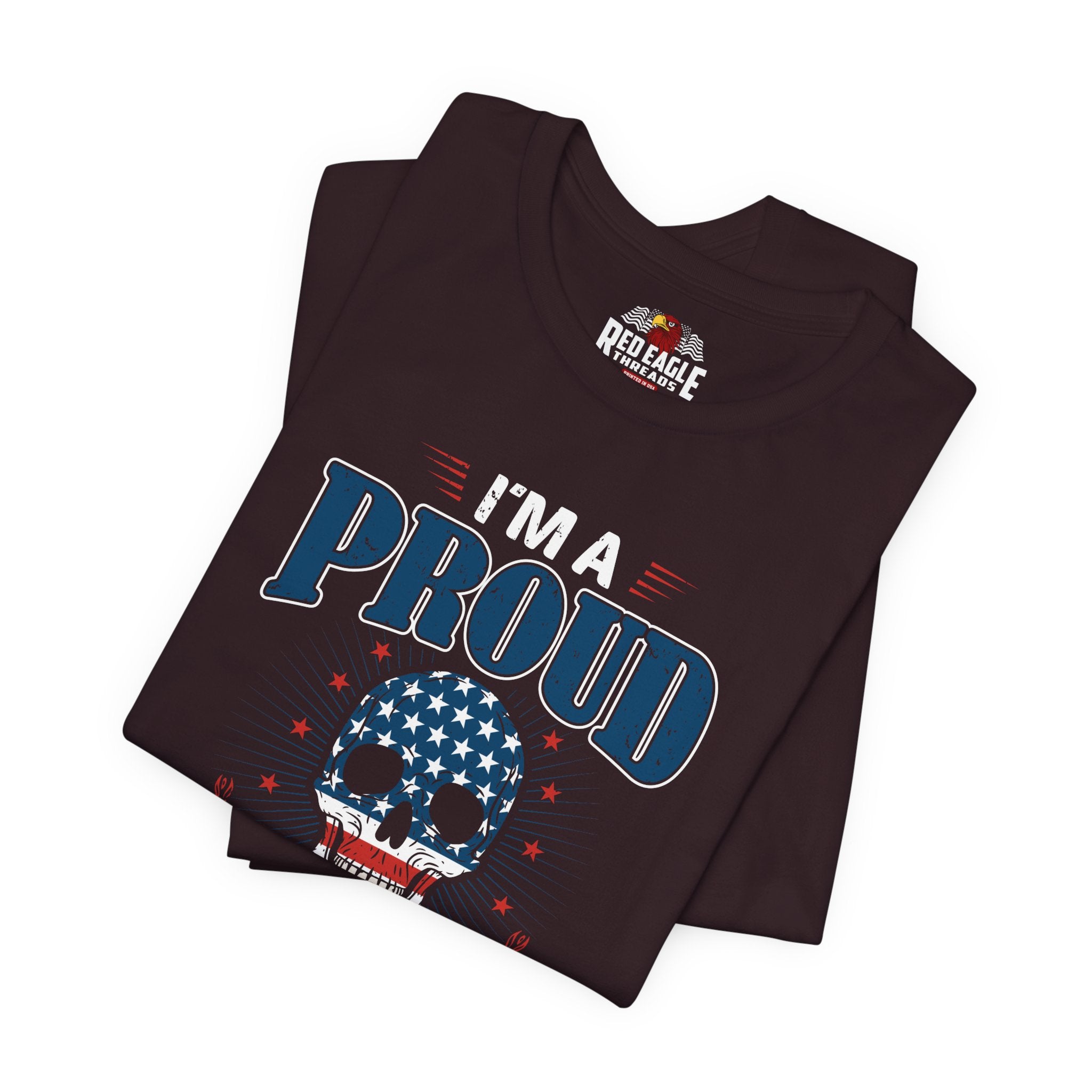 Folded black t-shirt with 'I'm a Proud' design and Red Eagle logo on a white background