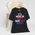 Black t-shirt with humorous text design on a hanger against a white background