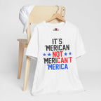 White t-shirt with humorous text design on a wooden chair against a white background
