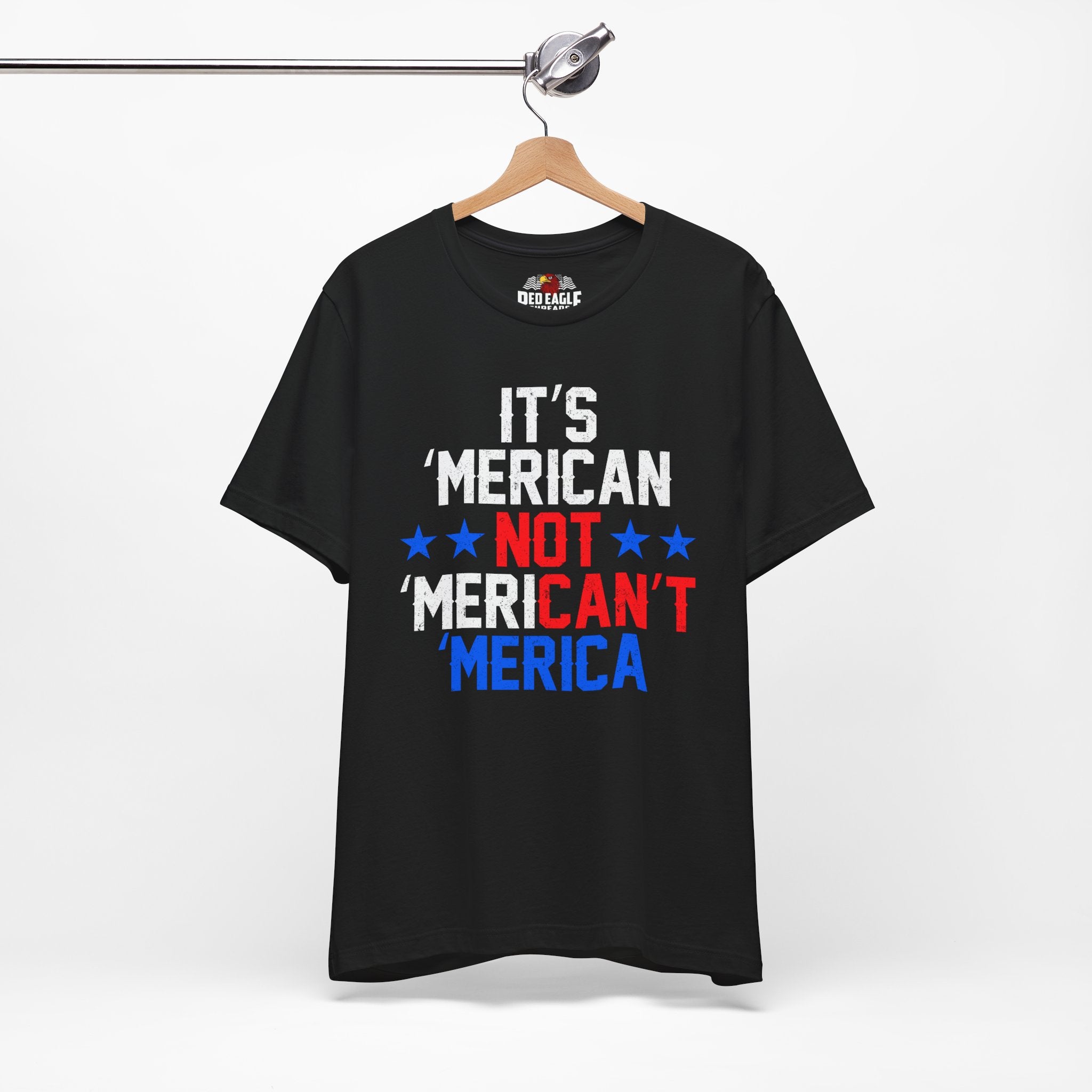 Black t-shirt with colorful text on a hanger against a white background