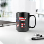 Black mug with 'LOVE' design featuring an American flag pattern on a white surface.