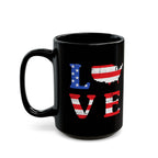 Black mug with American flag design spelling 'LOVE' on a white background
