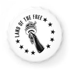 White bottle opener fridge magnet with black design of a hand holding a torch and 'Land of the Free' text, on a white background.