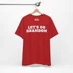 Red t-shirt with 'LET'S GO BRANDON' text on a hanger against a white background