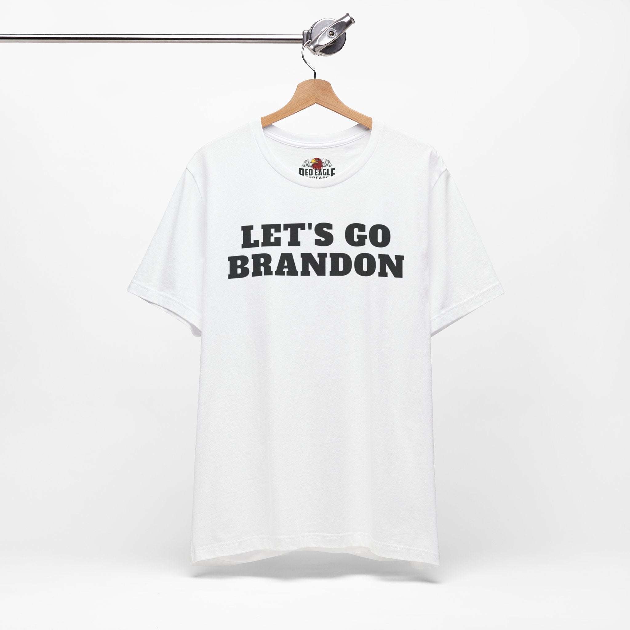 White sweatshirt with 'LET'S GO BRANDON' text on a hanger against a white background