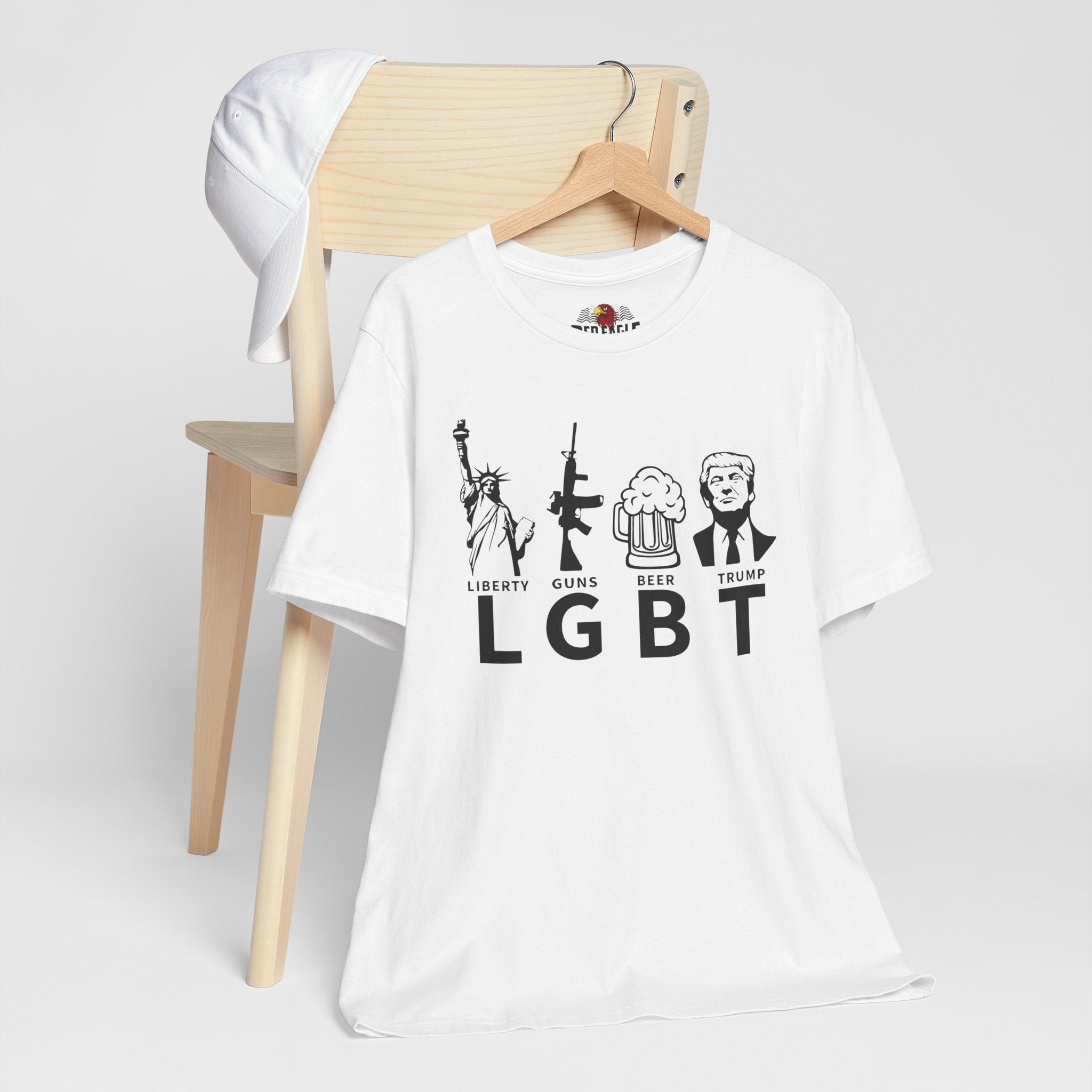White t-shirt with graphic design and text on a wooden chair against a white background