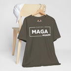 Army green t-shirt with 'MAGA AGAIN!' text on a wooden chair against a white background