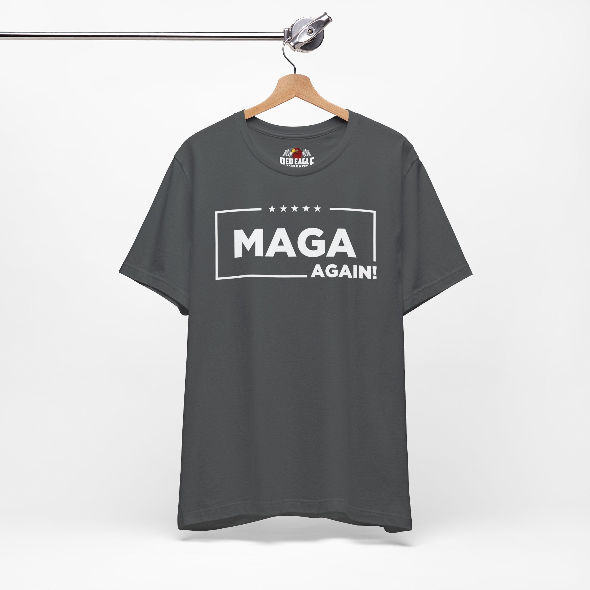 Asphalt t-shirt with 'MAGA AGAIN!' text on a hanger against a white background
