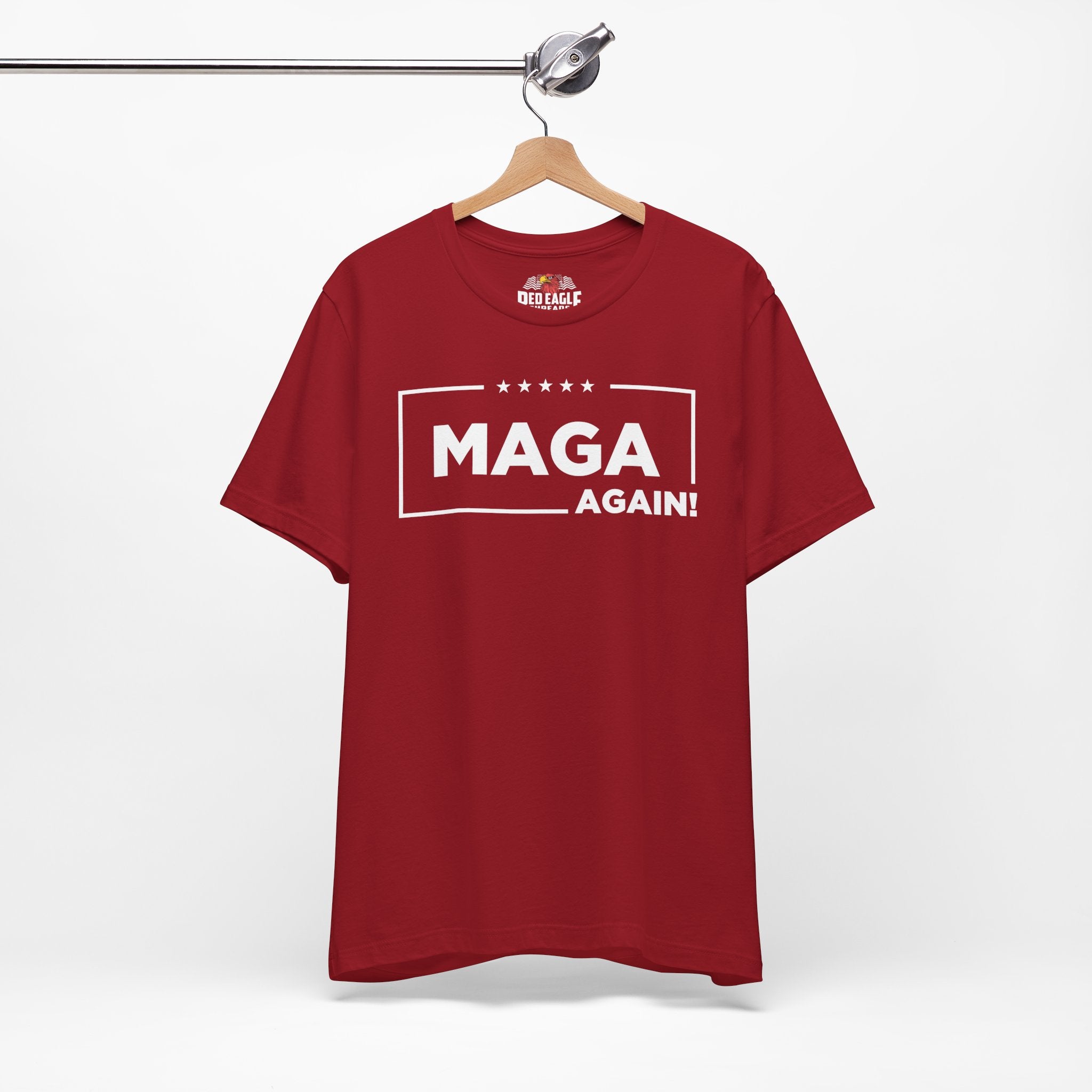 Red t-shirt with 'MAGA Again!' text on a hanger against a white background
