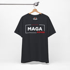 Vintage Black t-shirt with 'MAGA AGAIN!' text on a hanger against a white background