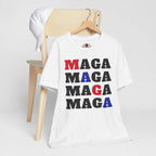 White t-shirt with 'MAGA' text in multiple colors on a white background
