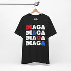 Black t-shirt with 'MAGA' text in red, white, and blue on a hanger against a white background.