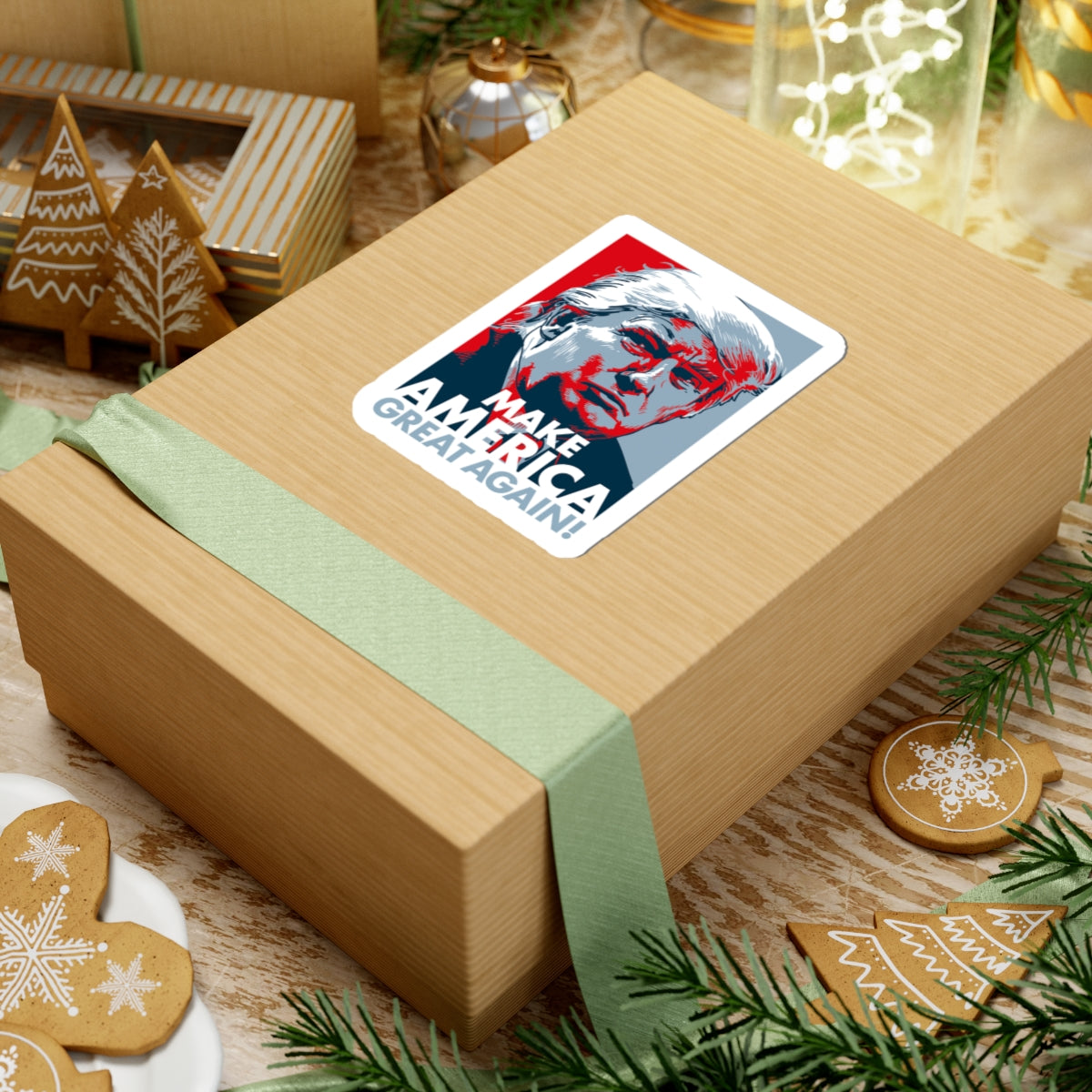 Gift box with a political sticker on a festive background with cookies and greenery.