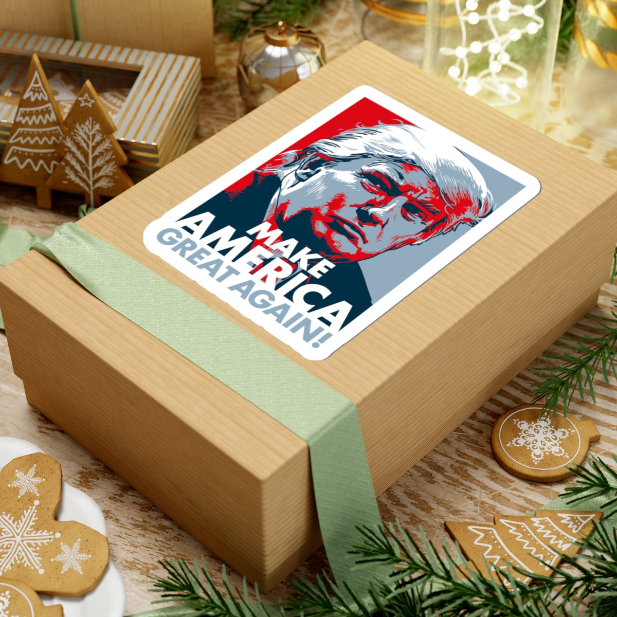 Gift box with a 'Make America Great Again' sticker on a festive background with cookies and Christmas decorations.