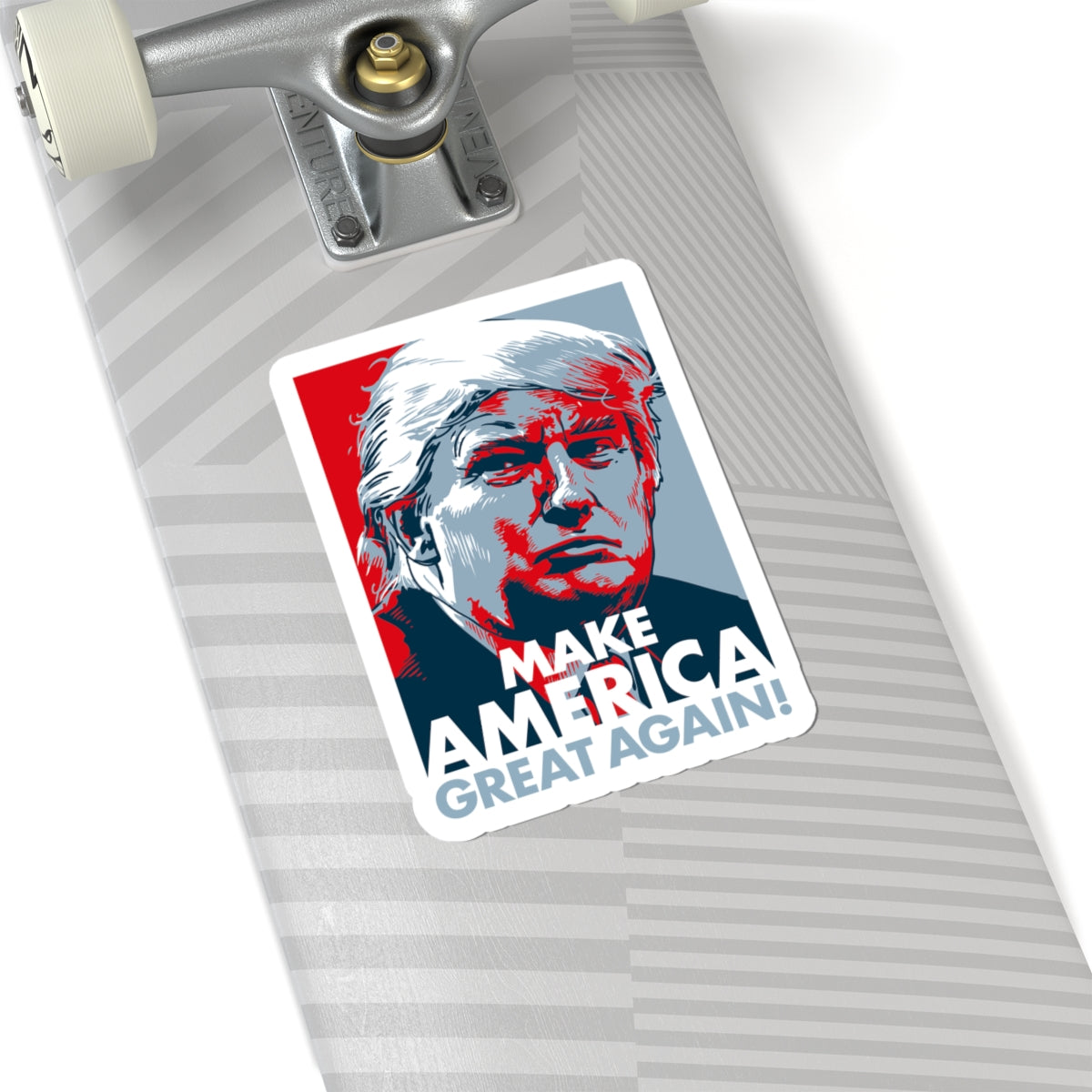 Skateboard with a 'Make America Great Again' sticker featuring a portrait.