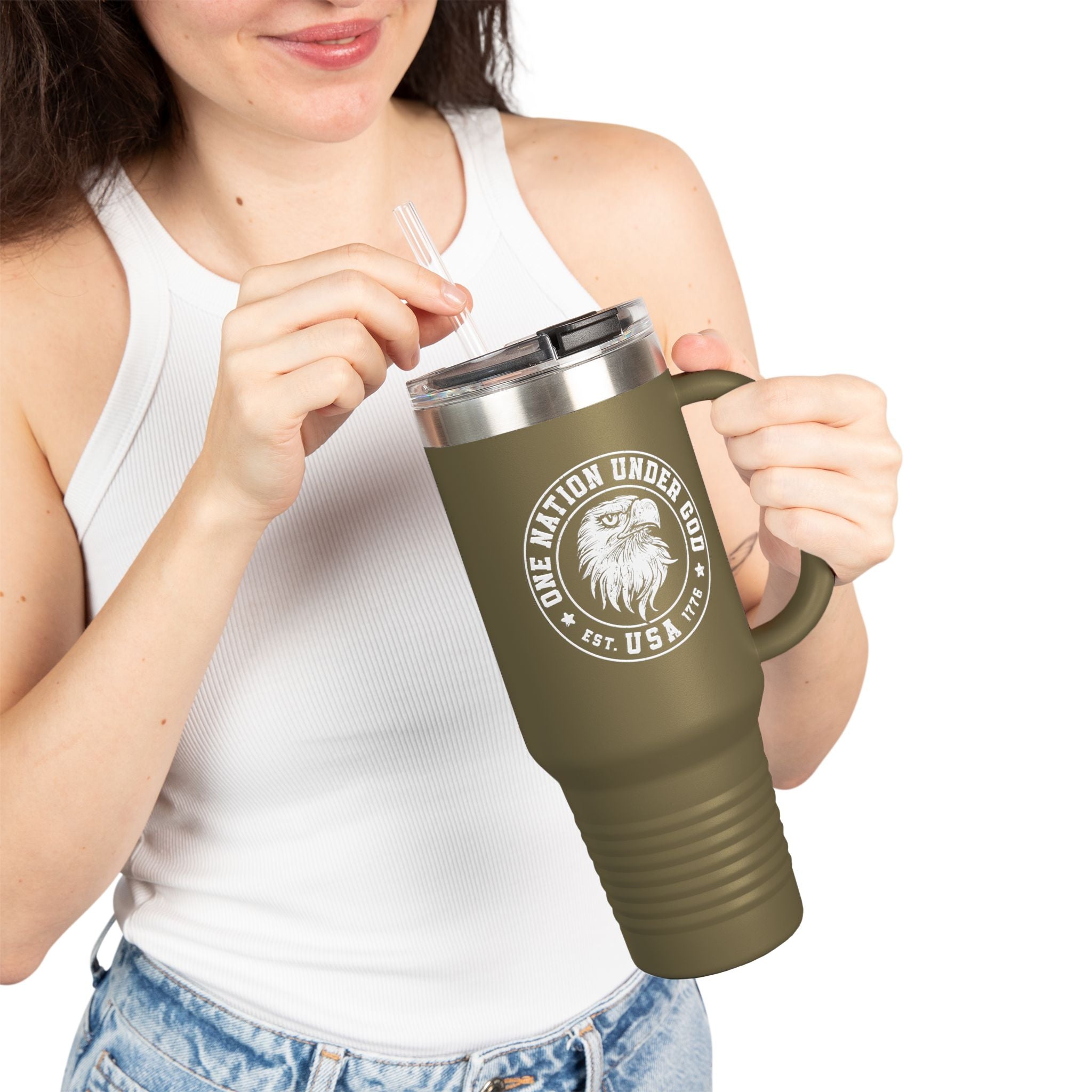 Person holding a green travel mug with a logo and text on a white background