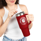 Person holding a red travel mug with a logo and text on a white background