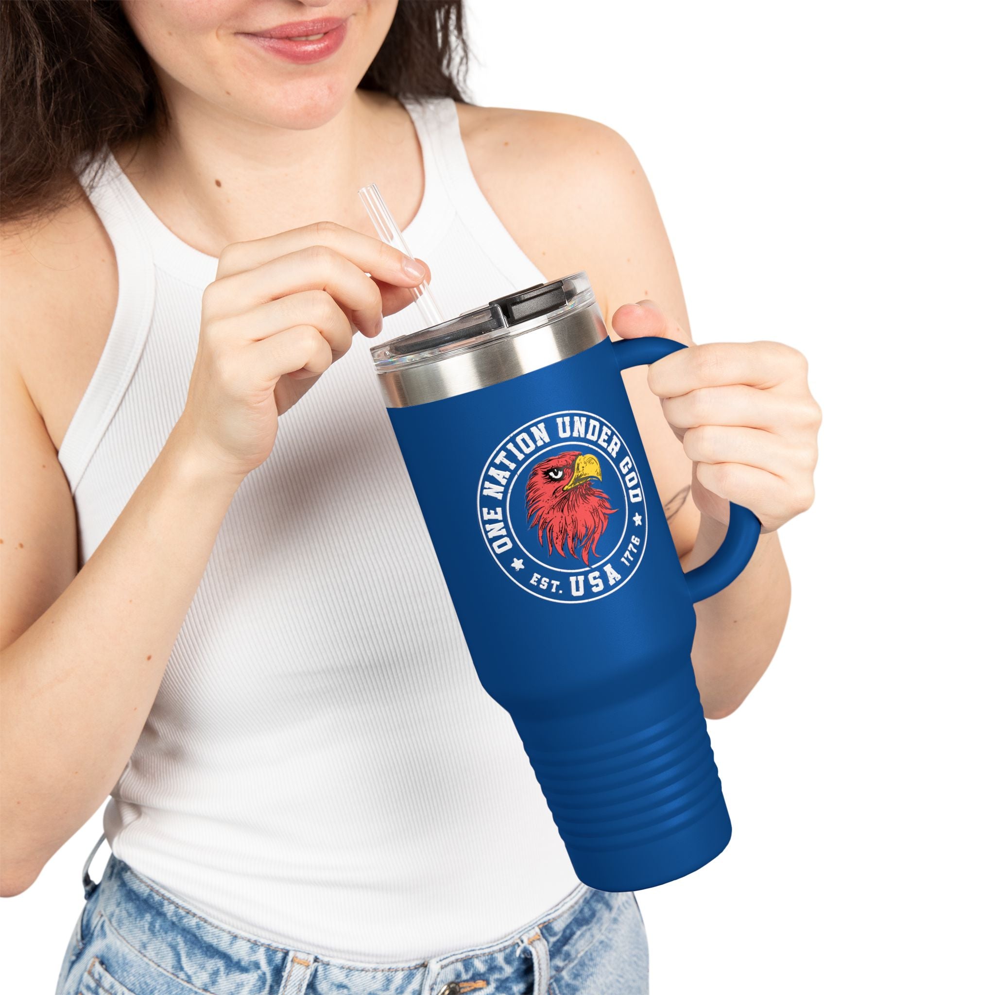 Person holding a blue travel mug with a logo and text on a white background