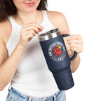 Person holding a navy blue travel mug with a logo and text on a white background