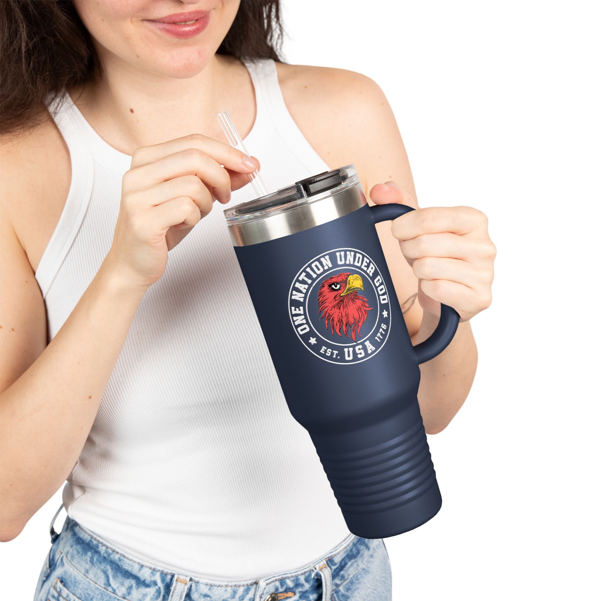 Person holding a navy blue travel mug with a logo and text on a white background