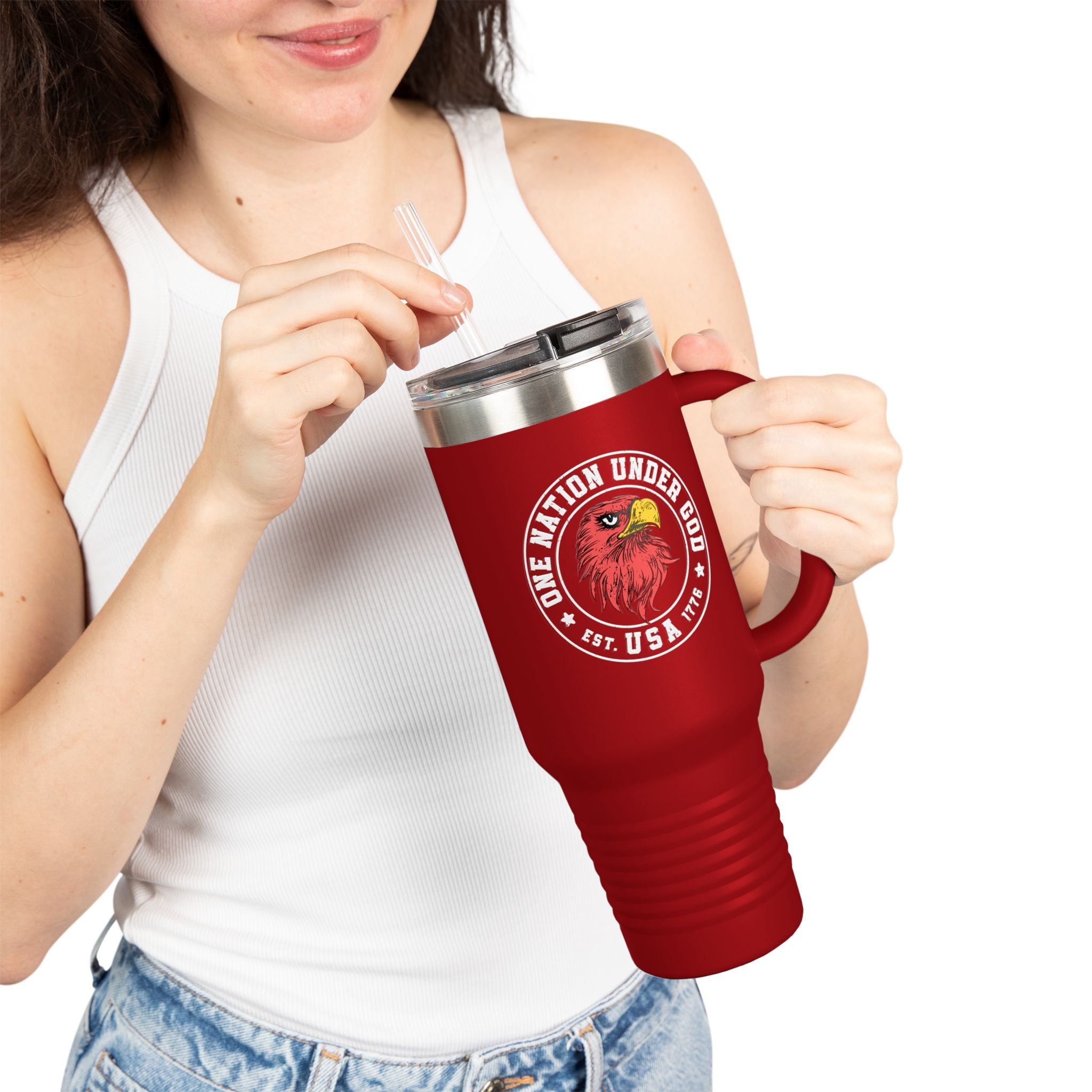 Person holding a red travel mug with a logo and text on a white background